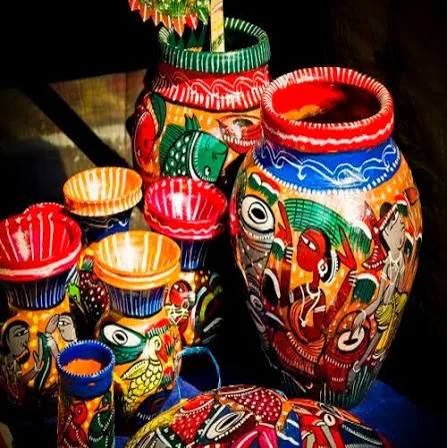 Hand-painted Indian blue pottery vases and bowls with folk motifs